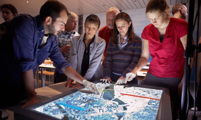 Stock photo of people looking at a map
